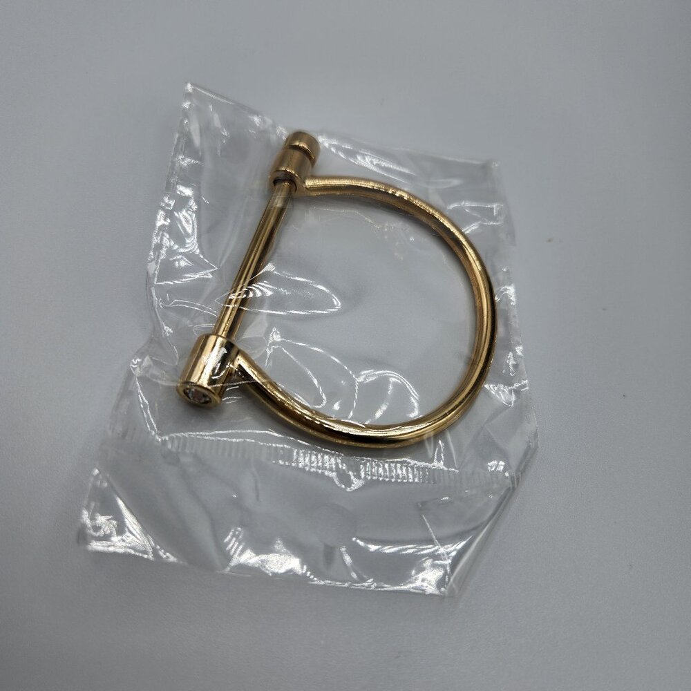 Gold  plated stainless steel horseshoe bracelet with removable pin and zirconia